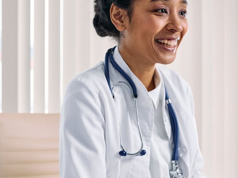 A nurse in scrubs at the start of a shift