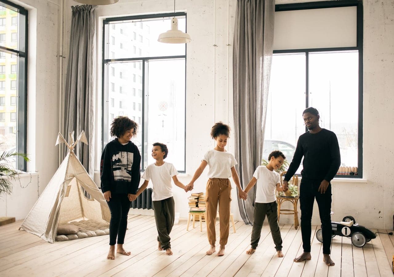 A family walking together through their home